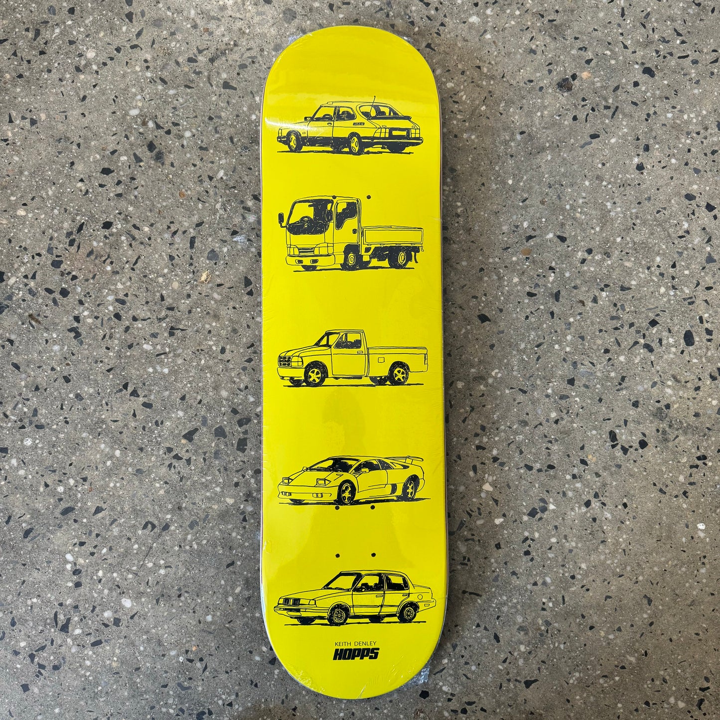 Series of hand drawn automobiles printed on yellow skate deck