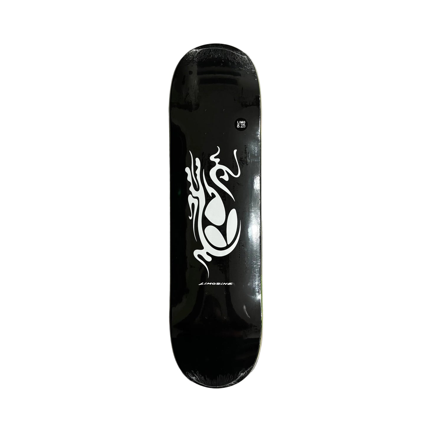 Black skateboard deck with white logo on a white surface