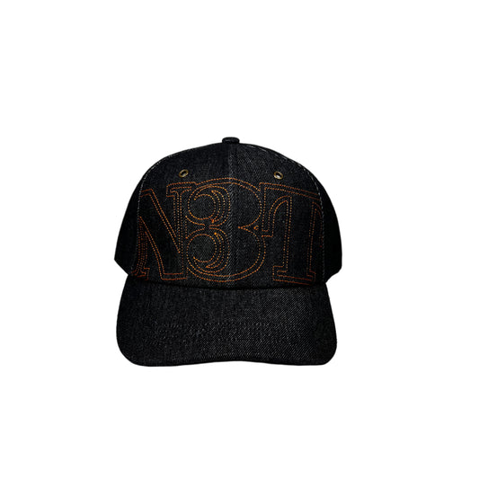 dark denim cap with an embroidered NET logo on a white surface