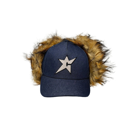 dark blue denim ear flap cap with fake fur trim and star emblem on a white background
