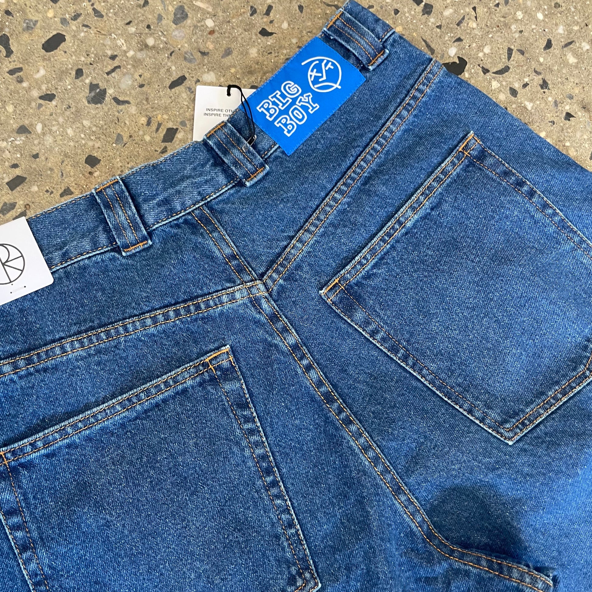 closeup of back pocket with blue patch logo