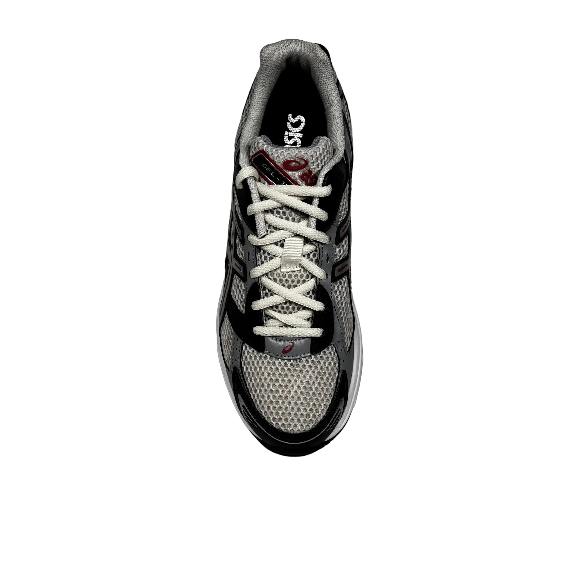 overhead view of Gray and black athletic shoe with white laces on a white background