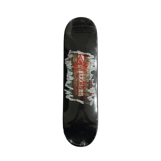 Black skateboard deck with a red and white graphic on a white surface