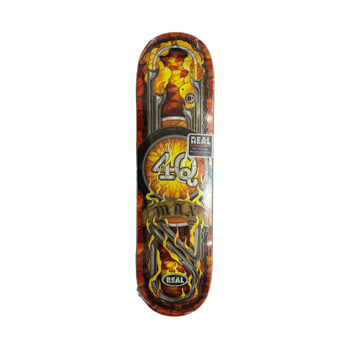 Skateboard deck with colorful design and 'Real' branding on a white surface.