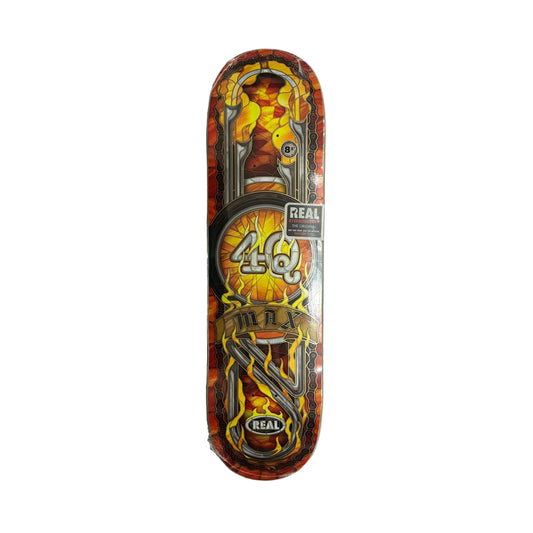 Skateboard deck with colorful design and 'Real' branding on a white surface.