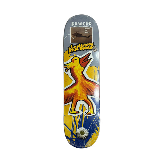 Skateboard deck with colorful design and brand logos on a white surface.