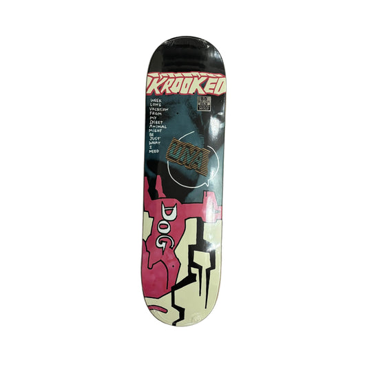 Skateboard deck with 'Krooked' and 'Dog' logos on a white surface.