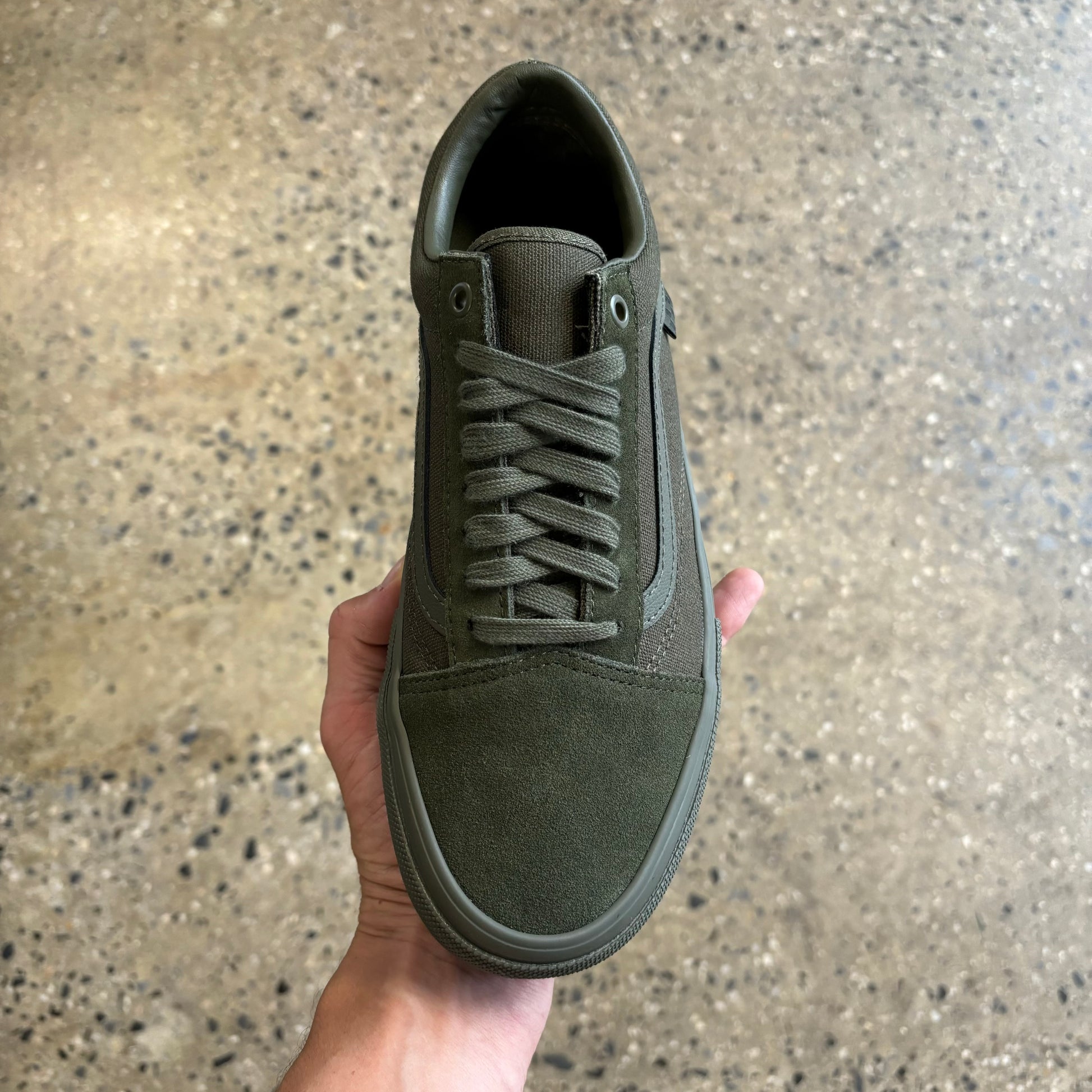 Top down view of green suede sneaker