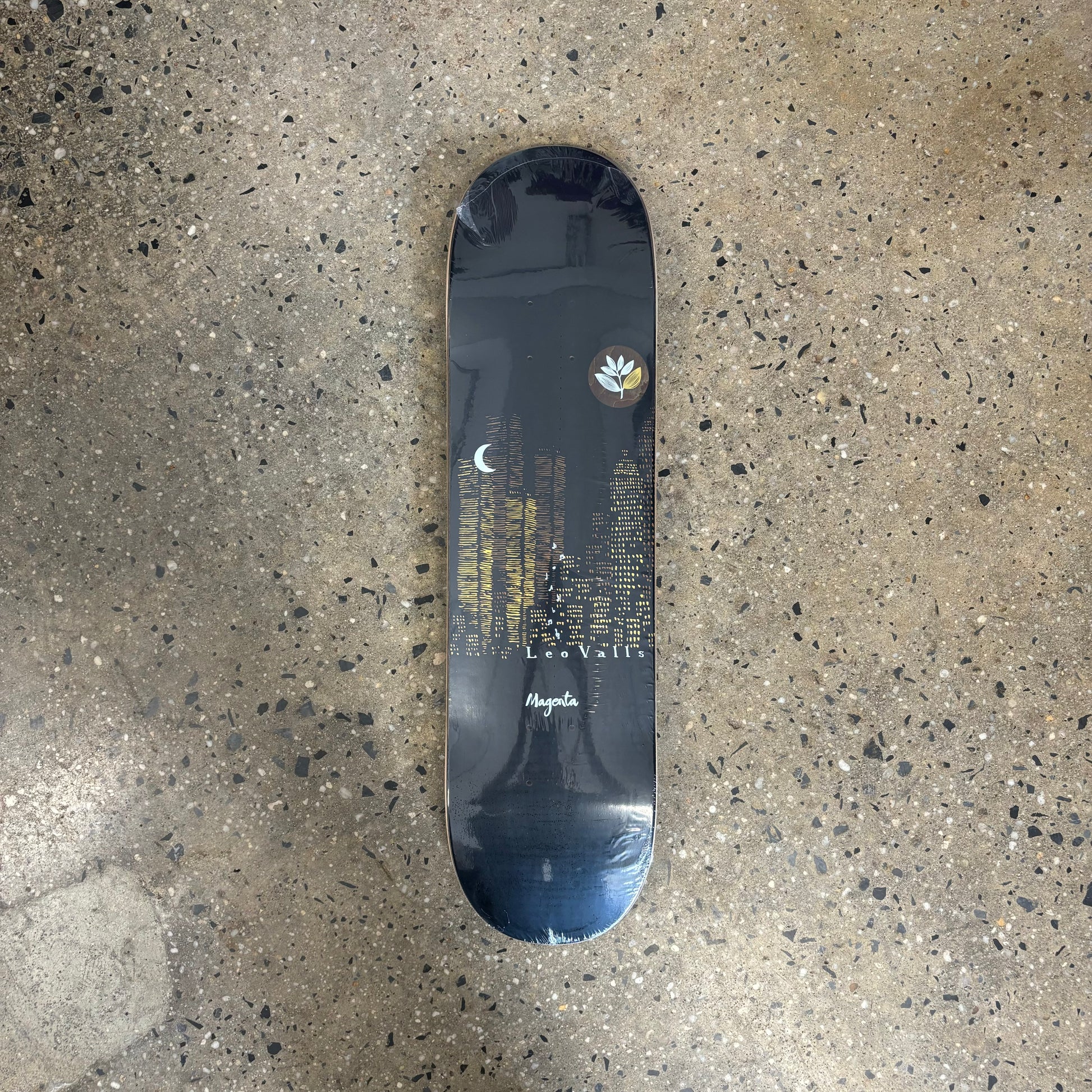 Navy blue background with skyscrapers in the background on skateboard deck