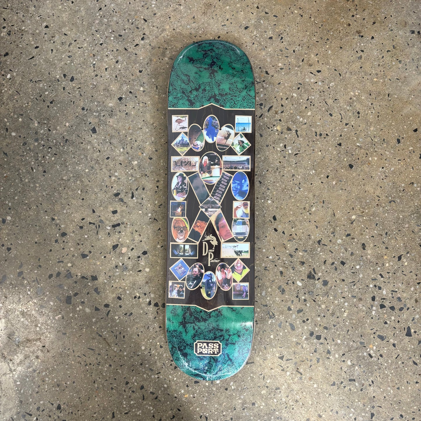 Assorted photo collage on green and black skateboard deck