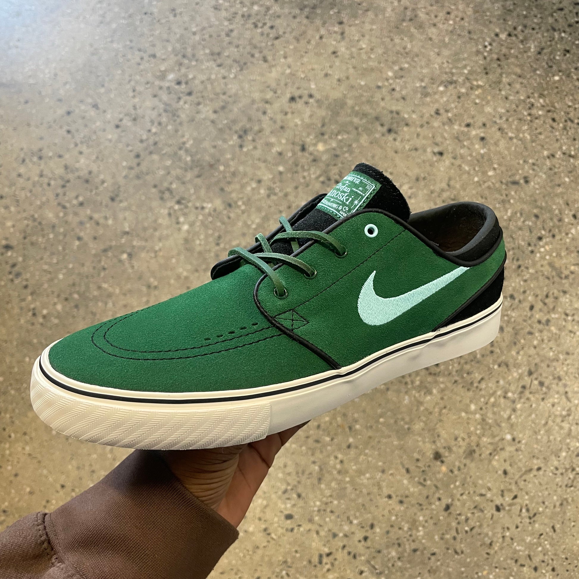 green suede sneaker with white sole