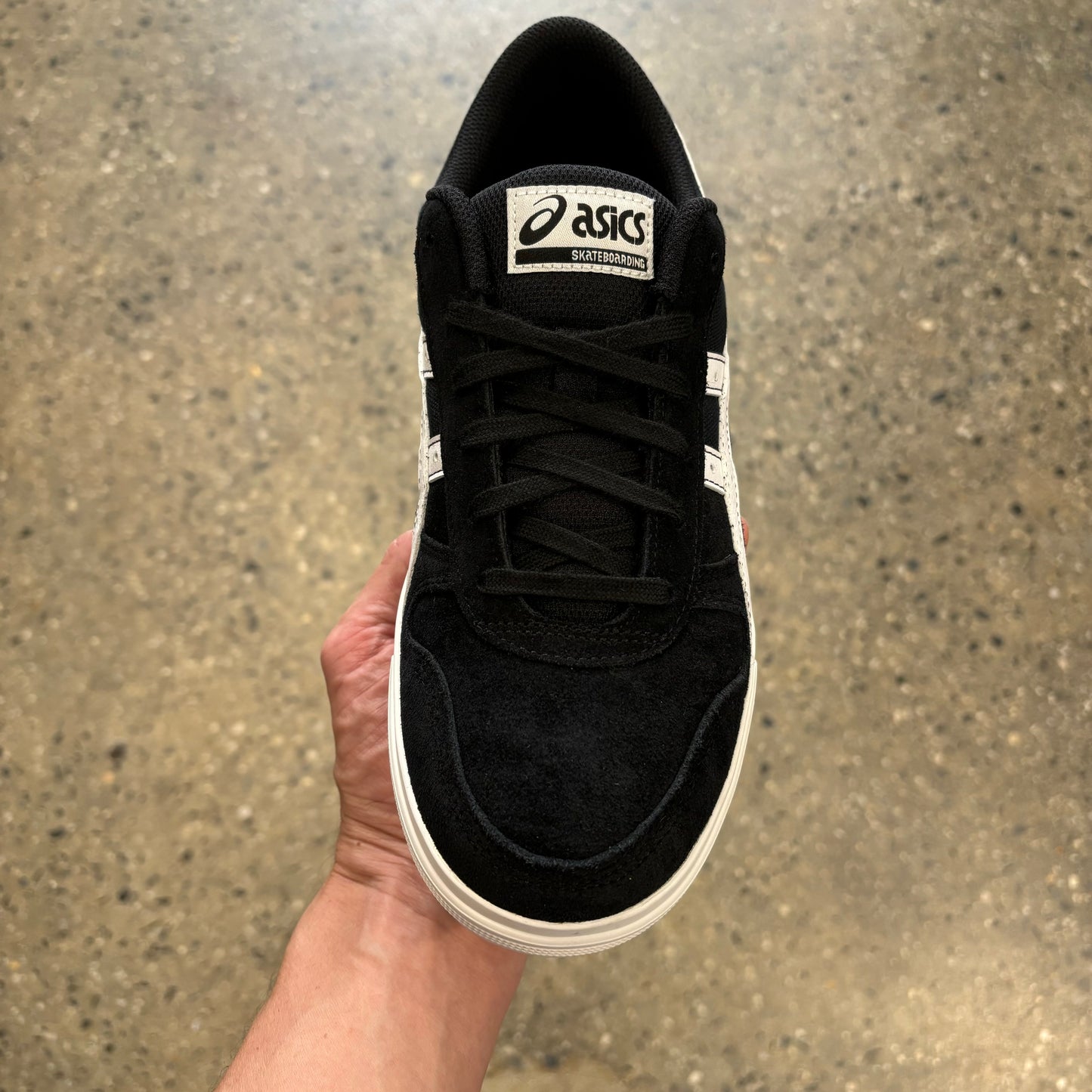 top down view of black and white suede skateboard sneaker