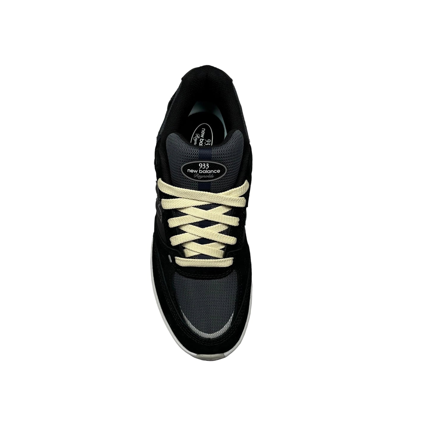 Black sneaker with cream laces on a white background
