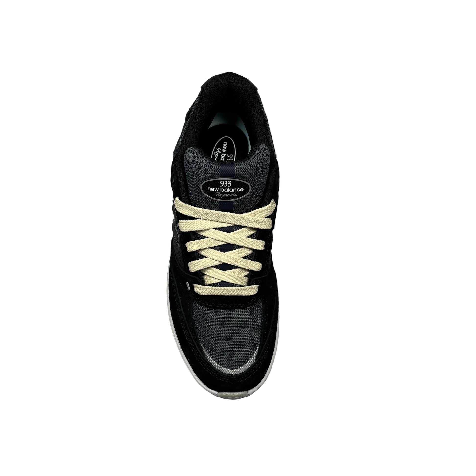 Black sneaker with cream laces on a white background