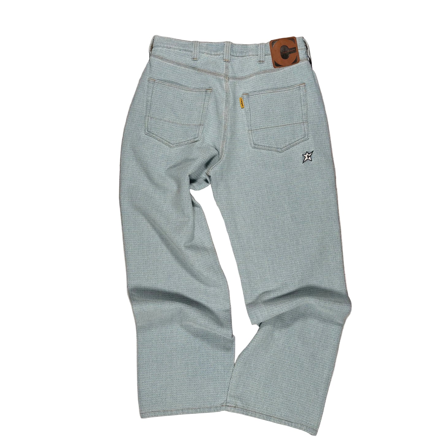 rear of Light blue jeans on white background