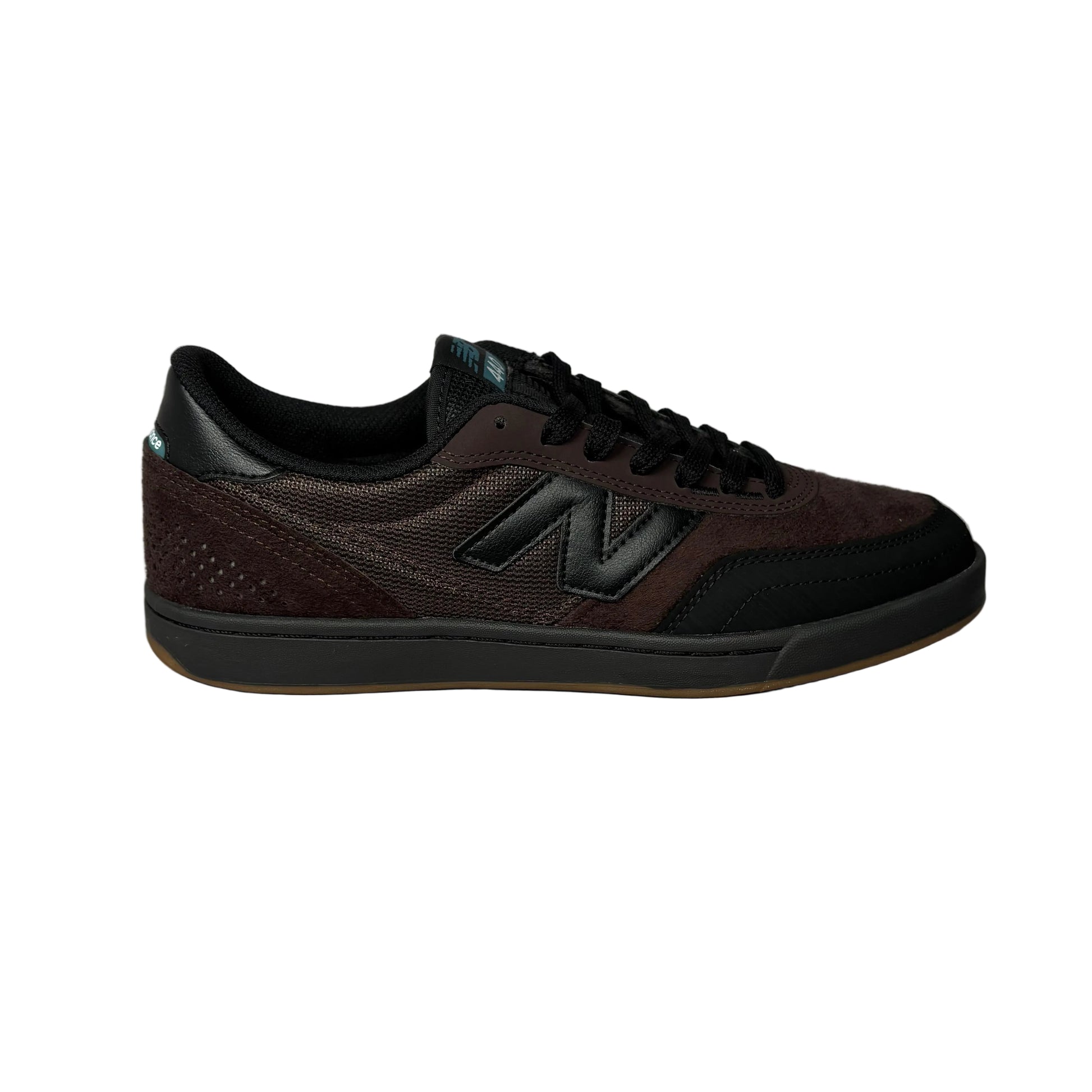 Dark brown sneaker with New Balance logo on a white surface