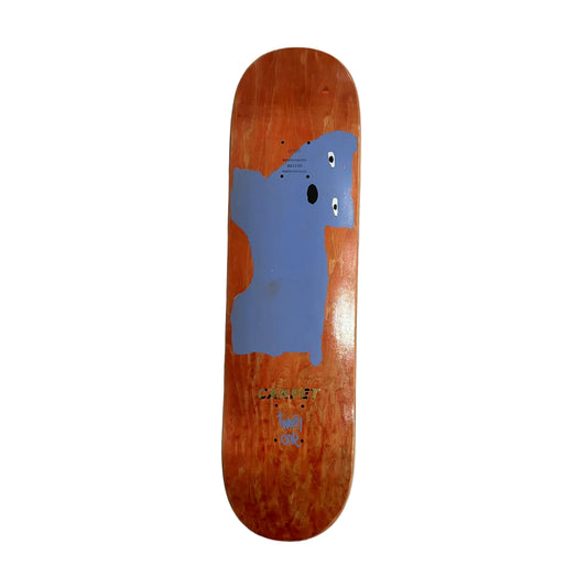 Skateboard deck with a blue animal design on a white surface
