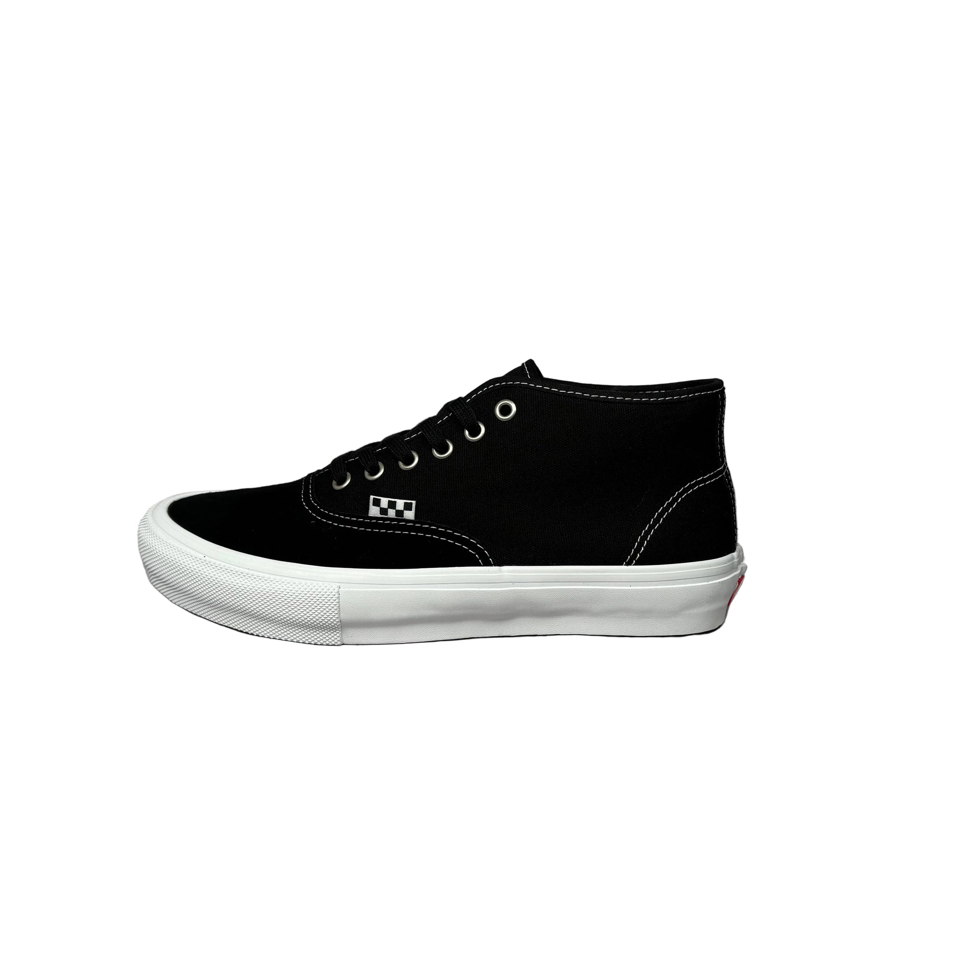 black sneaker with a textured sole on a white background
