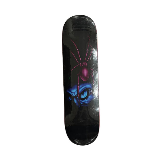 Skateboard deck with a spider design on a white surface