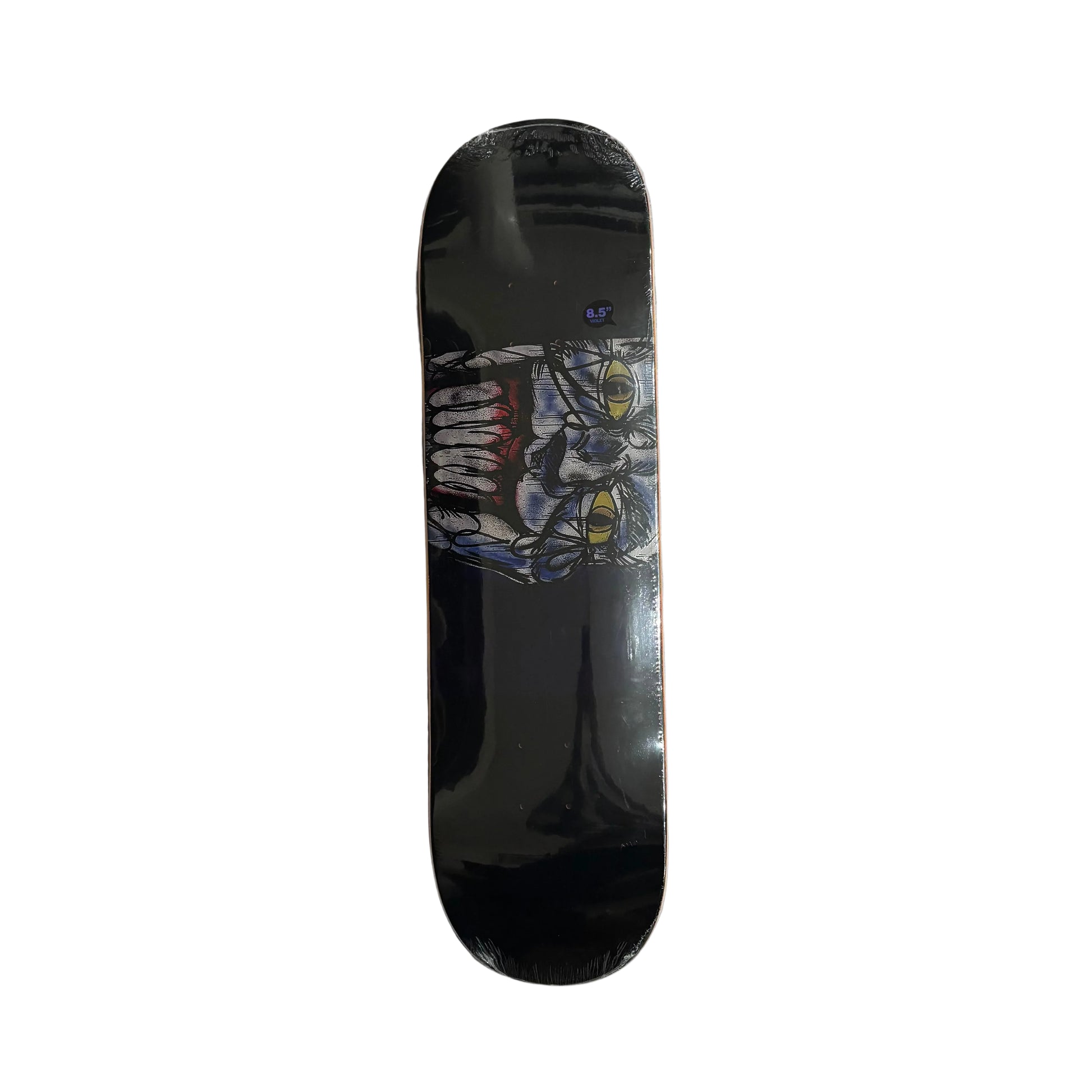 Skateboard deck with a joker graphic design on a white surface