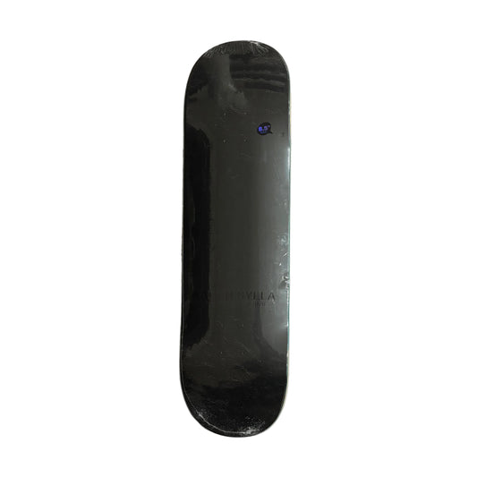 Black skateboard deck on a white surface