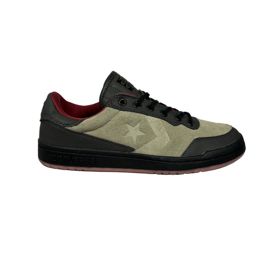 Sneaker with a star logo on a gray background