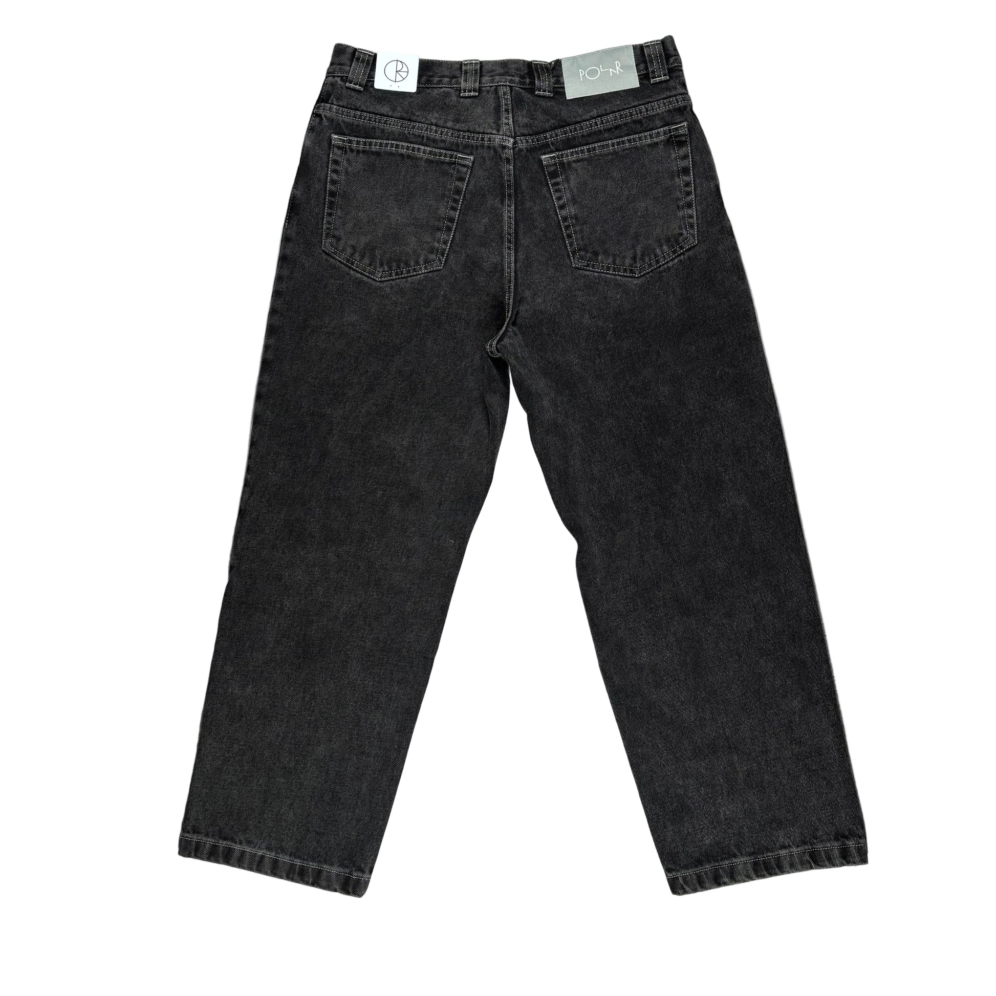 rear view of Black jeans on a white surface