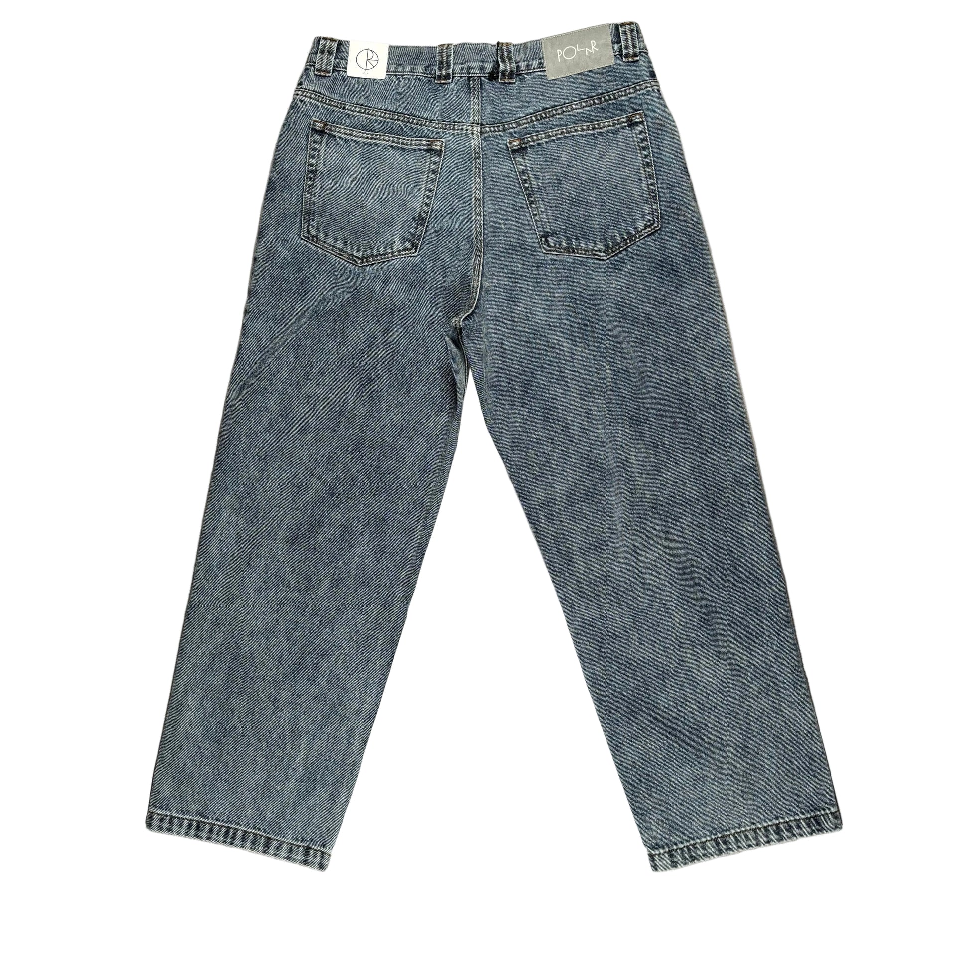 rear of Pair of blue jeans on a white surface