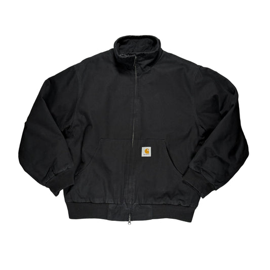 Black jacket with mock neck, a brand logo on a white surface