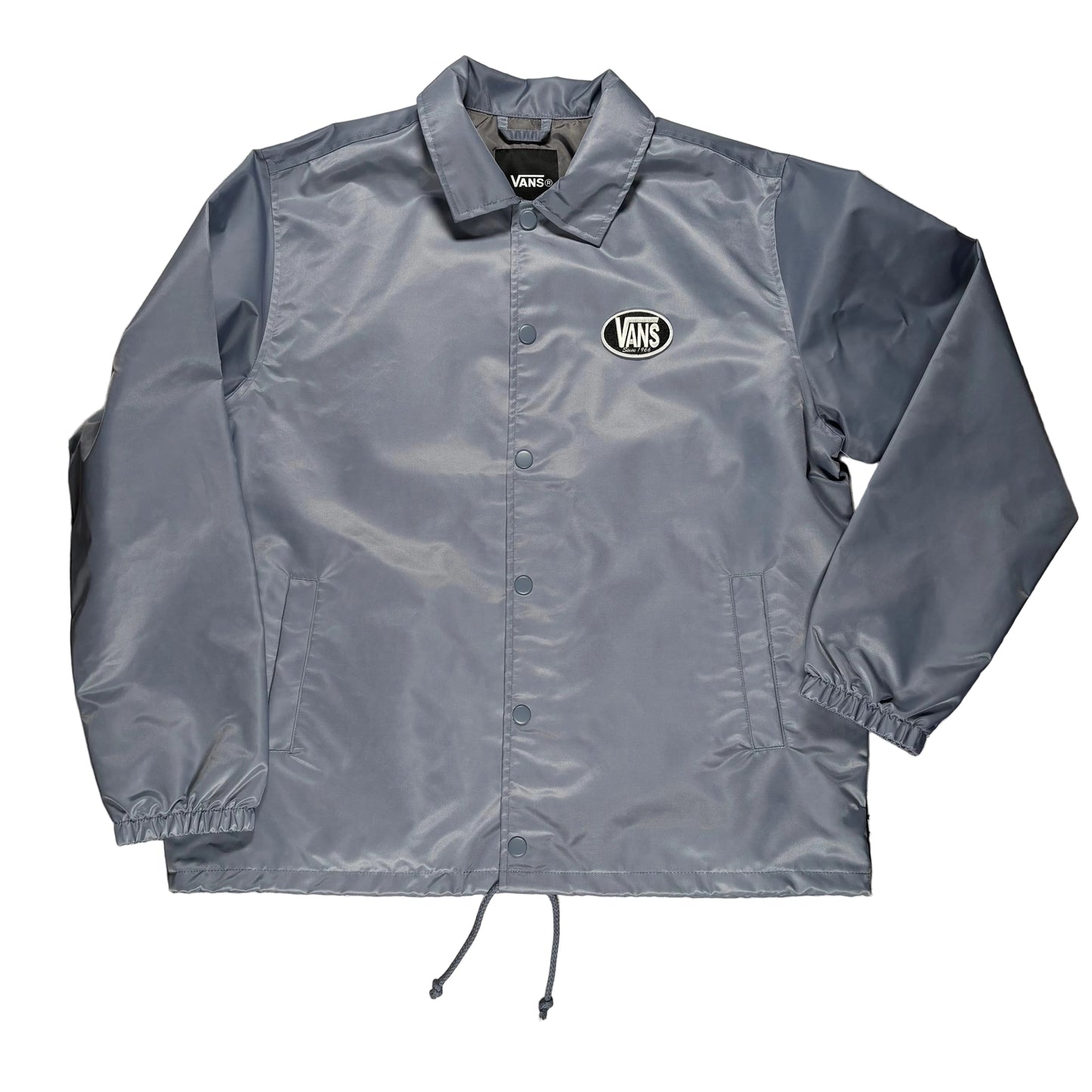 Gray nylon jacket with a brand logo on a gray surface