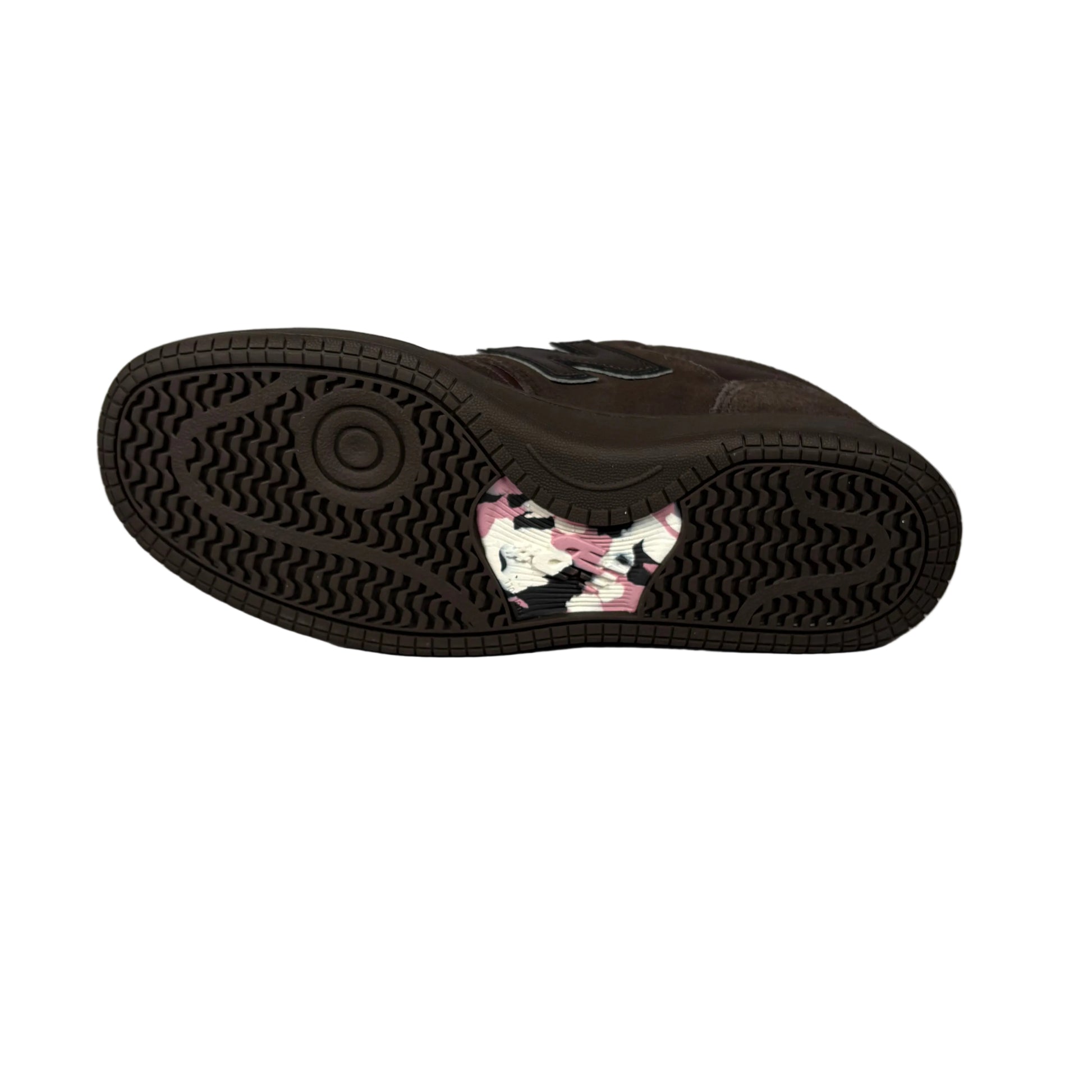 Black sneaker sole with floral pattern in middle of sole on a white background