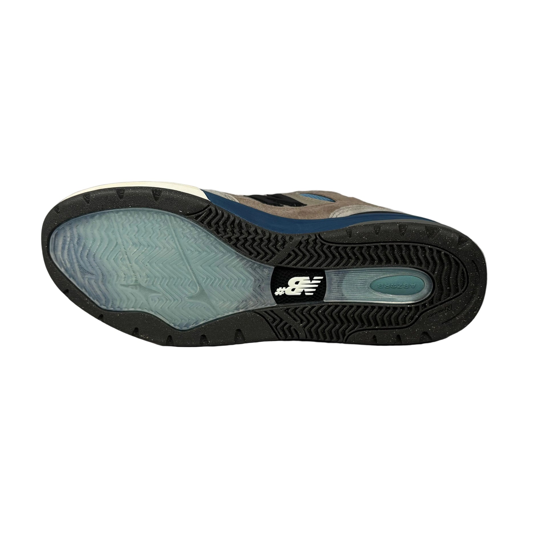 Sole of a sneaker with New Balance logo on a white background