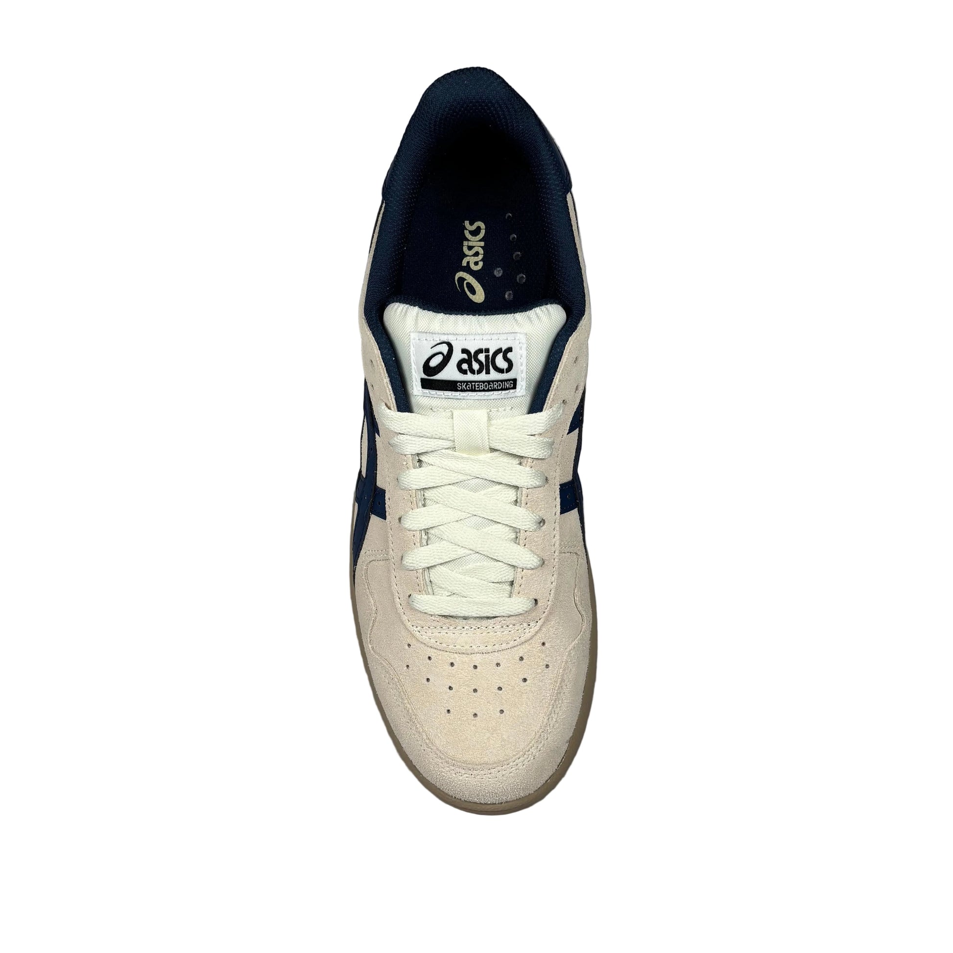 White sneaker with navy accents on a white background