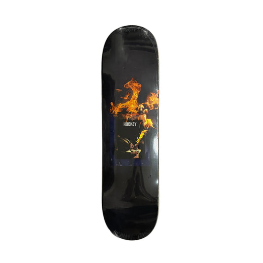Skateboard deck with flame design on a white surface