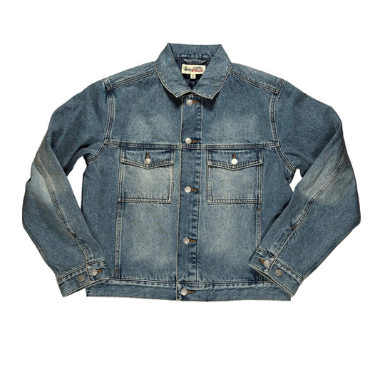 Blue denim jacket on a white surface