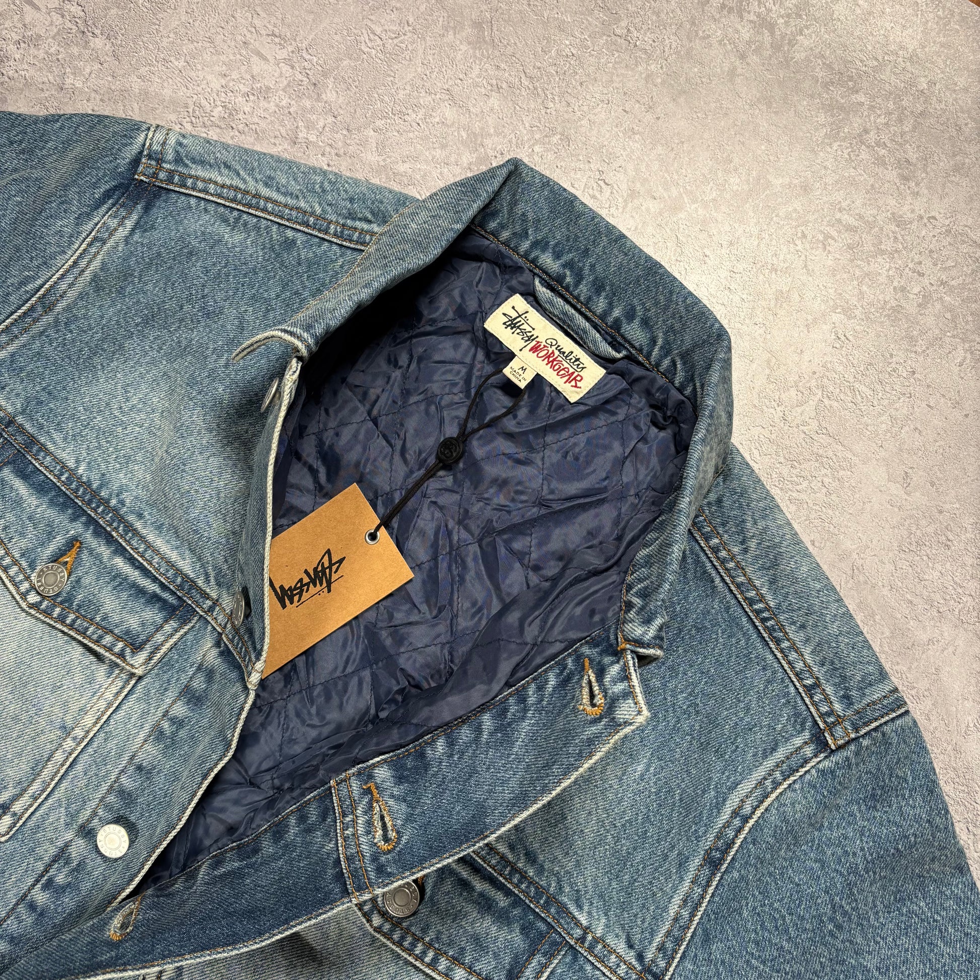 Blue denim jacket on a white background