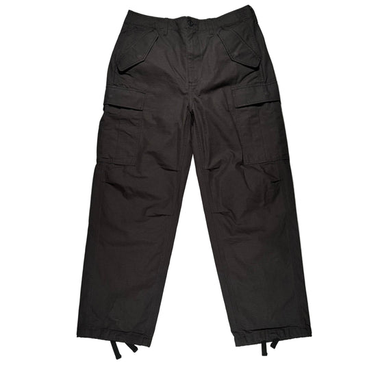 Black cargo pants on a white surface