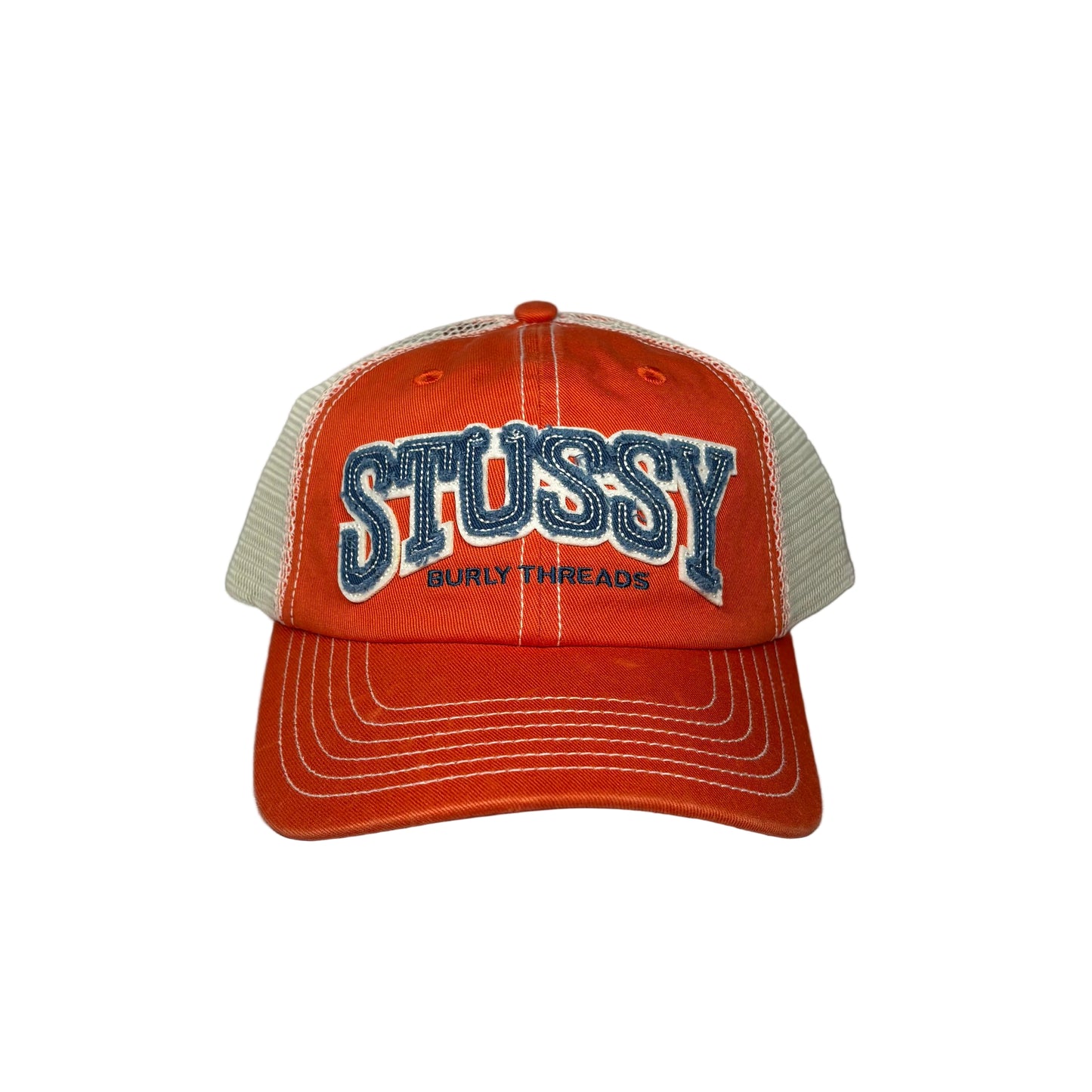 Orange Stussy cap with blue and white text on a white background