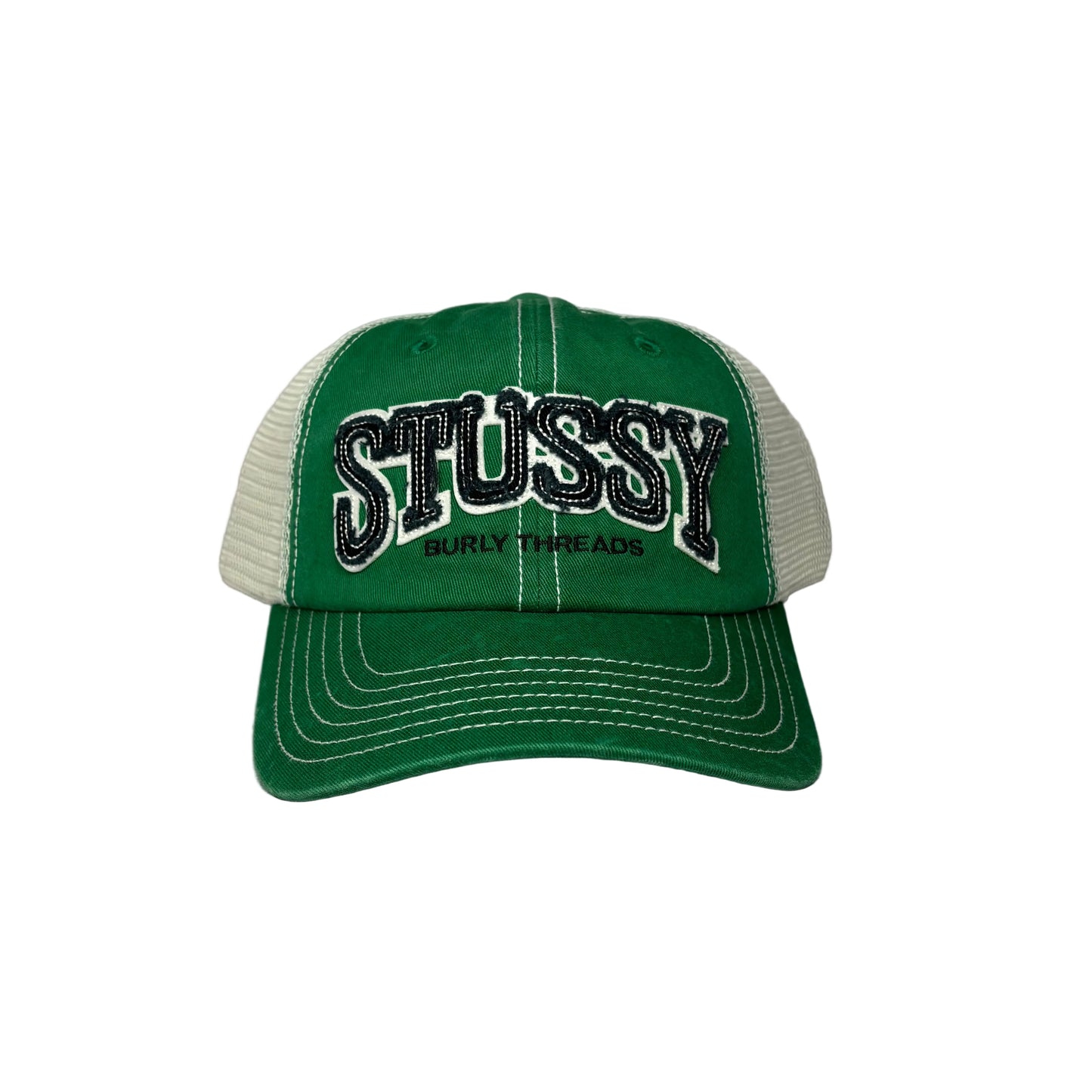 Green and white cap with 'Stussy' branding on a white background