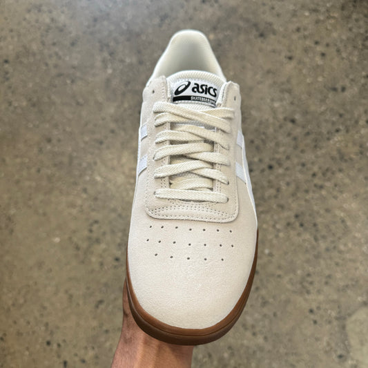 cream suede sneaker with white stripes and gum sole, front view