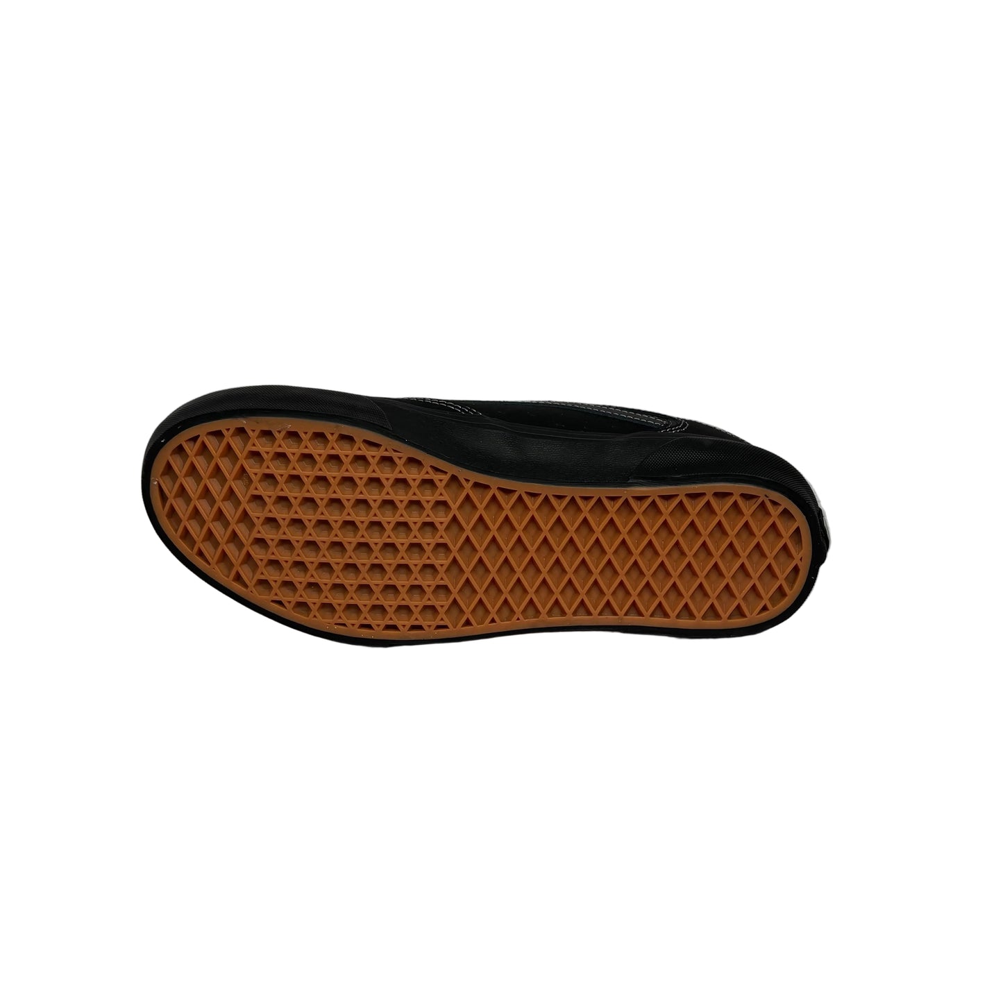 Black shoe sole with brown waffle pattern on a white background