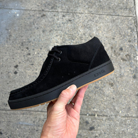 side view of black suede shoe