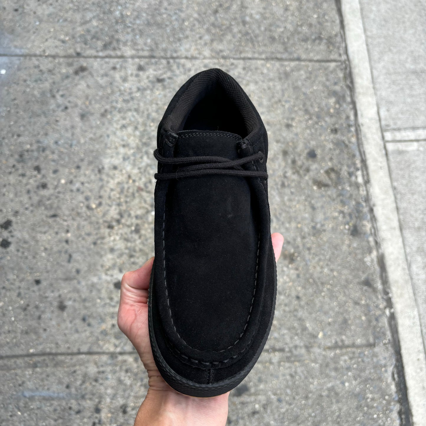 top down view of black suede skateboard shoe