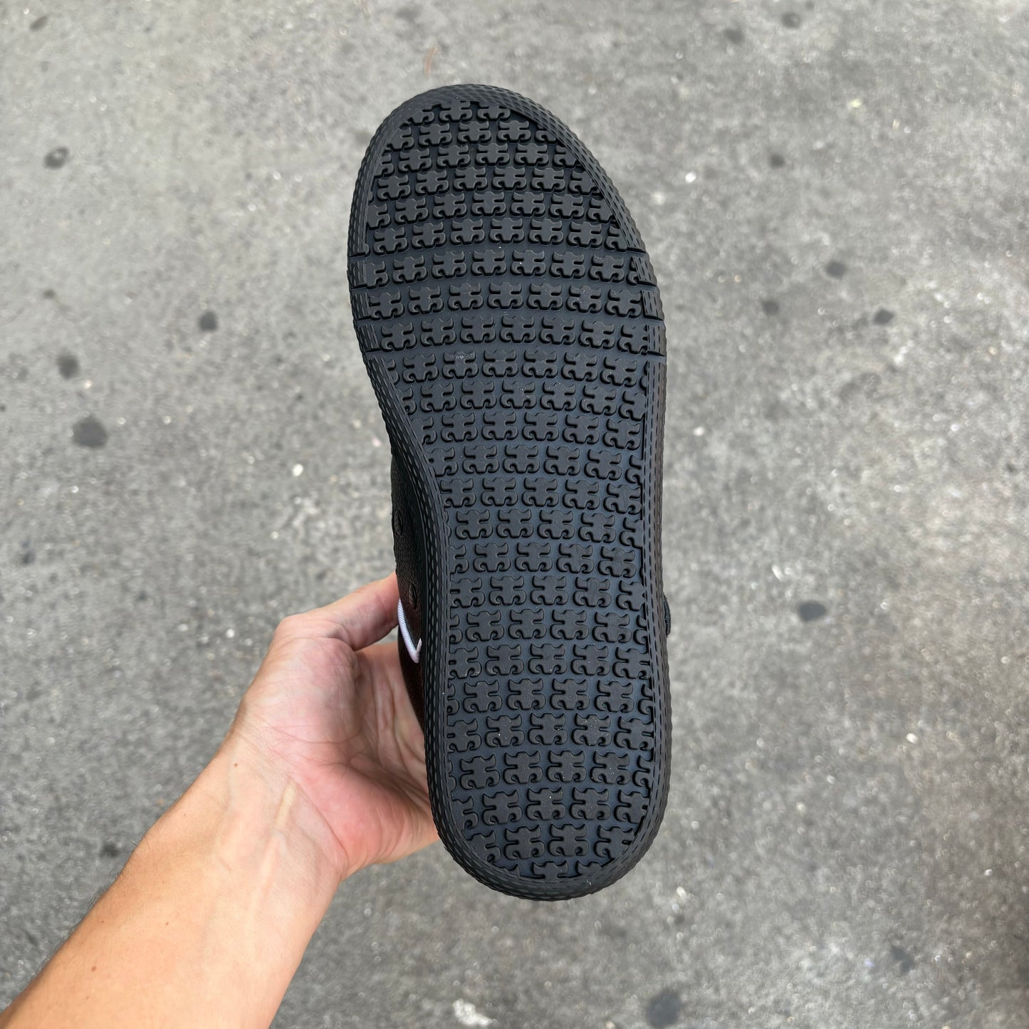 view of black rubber outsole with ipath logo