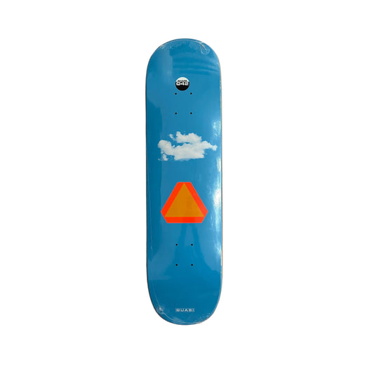 Blue skateboard deck with a red triangle and white cloud design on a white surface.