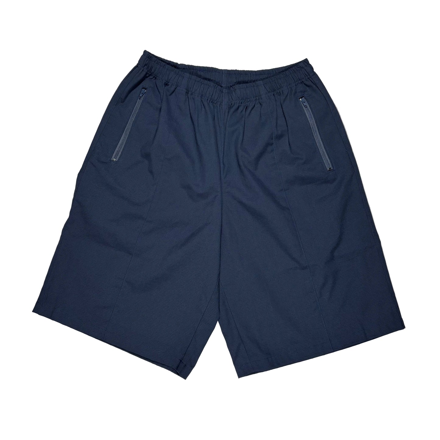 A pair of navy blue athletic shorts with an elastic waistband and two zippered side pockets, laid flat on a white surface