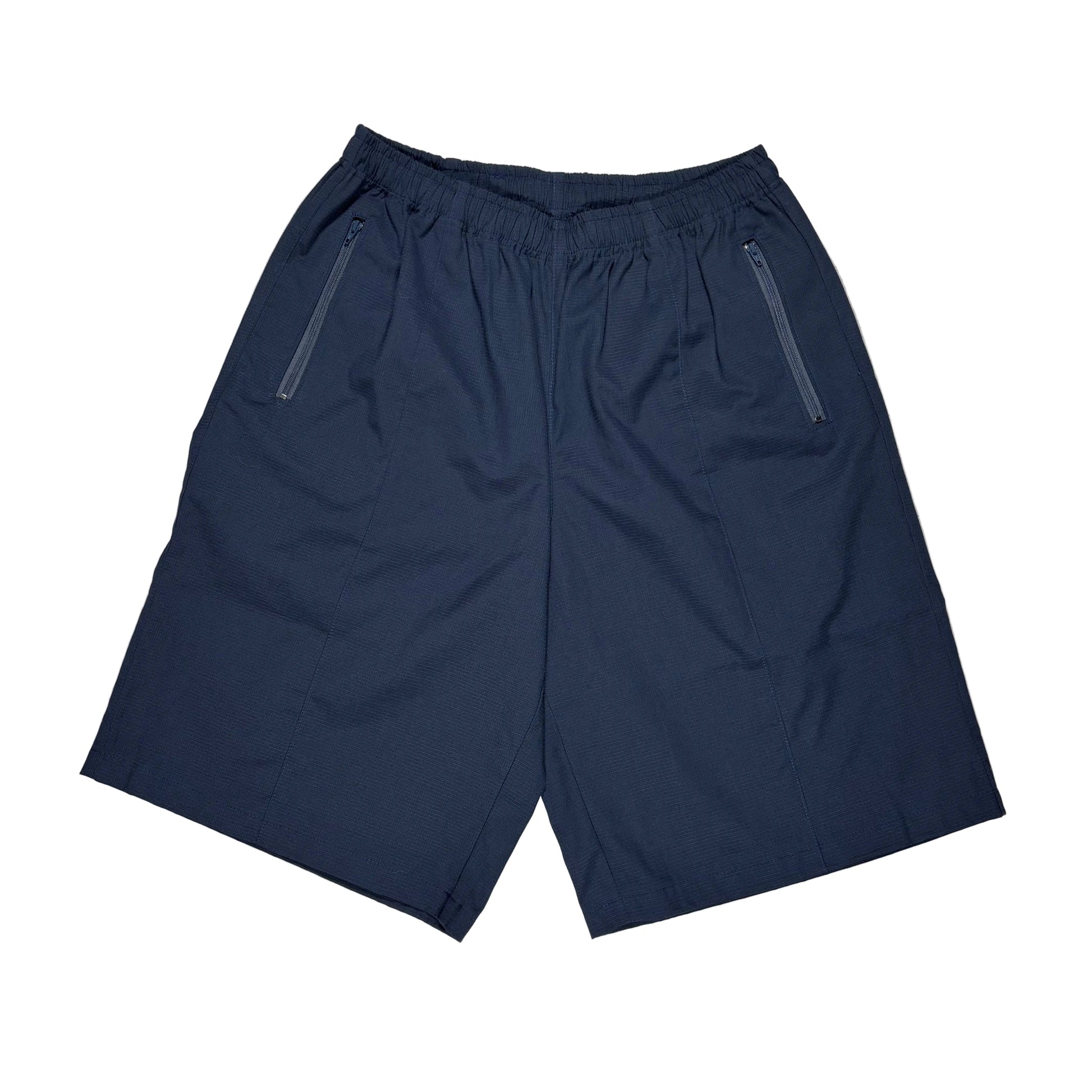 A pair of navy blue athletic shorts with an elastic waistband and two zippered side pockets, laid flat on a white surface