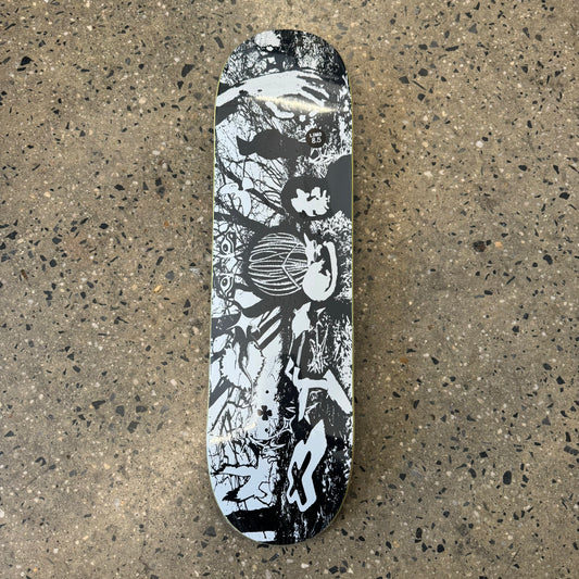 black and white outdoor scene with people, trees and soil, printed on a skate deck