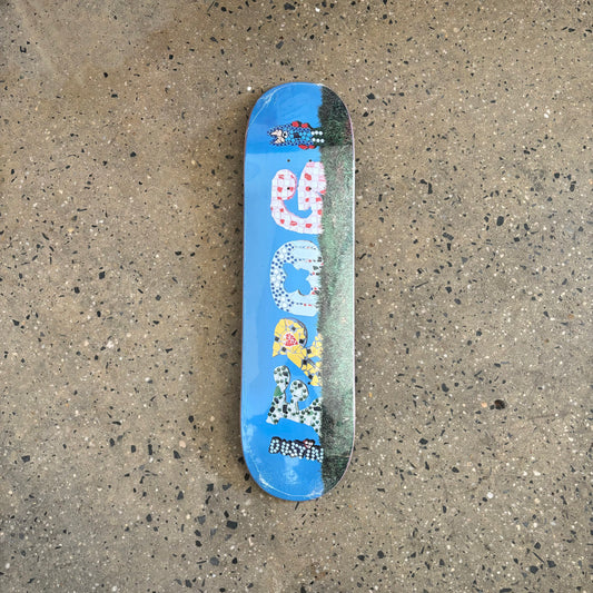 Frog written in tile mosaic on skateboard deck