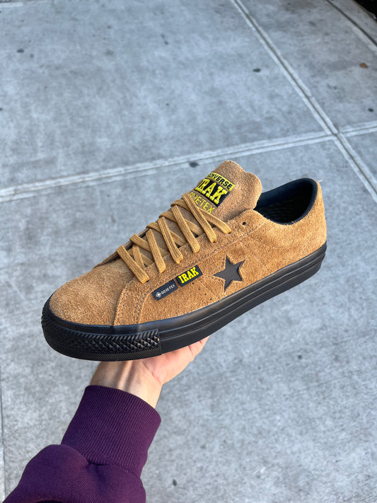 side view of brown and black suede gore tex skateboard sneaker